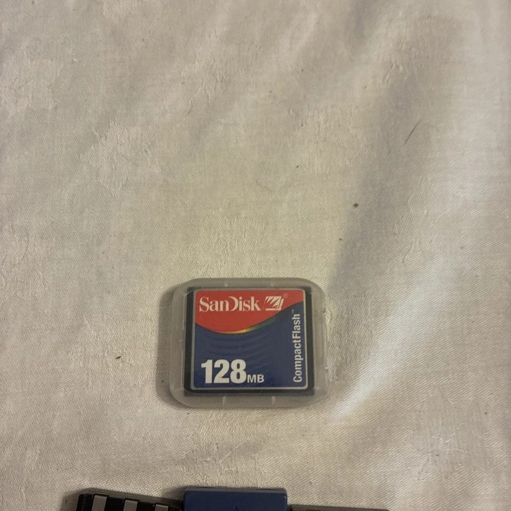 canon battery charger CB-2LS, 3 batteries, And One Sim Card Working